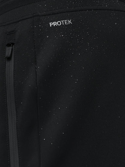 Black jacket with 'PROTEK' branding on a dark background