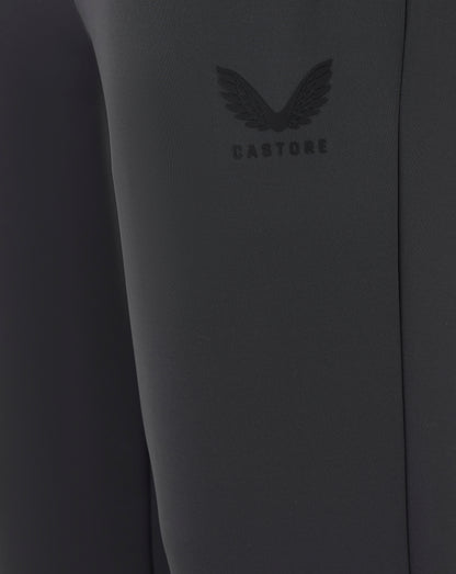 Close-up of a dark gray garment with a brand logo on a plain background