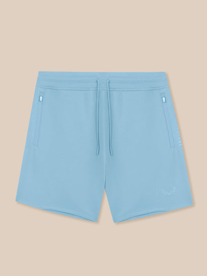 Light blue shorts on a beige background