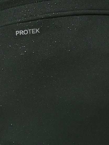 Close-up of a black surface with 'PROTEK' branding.