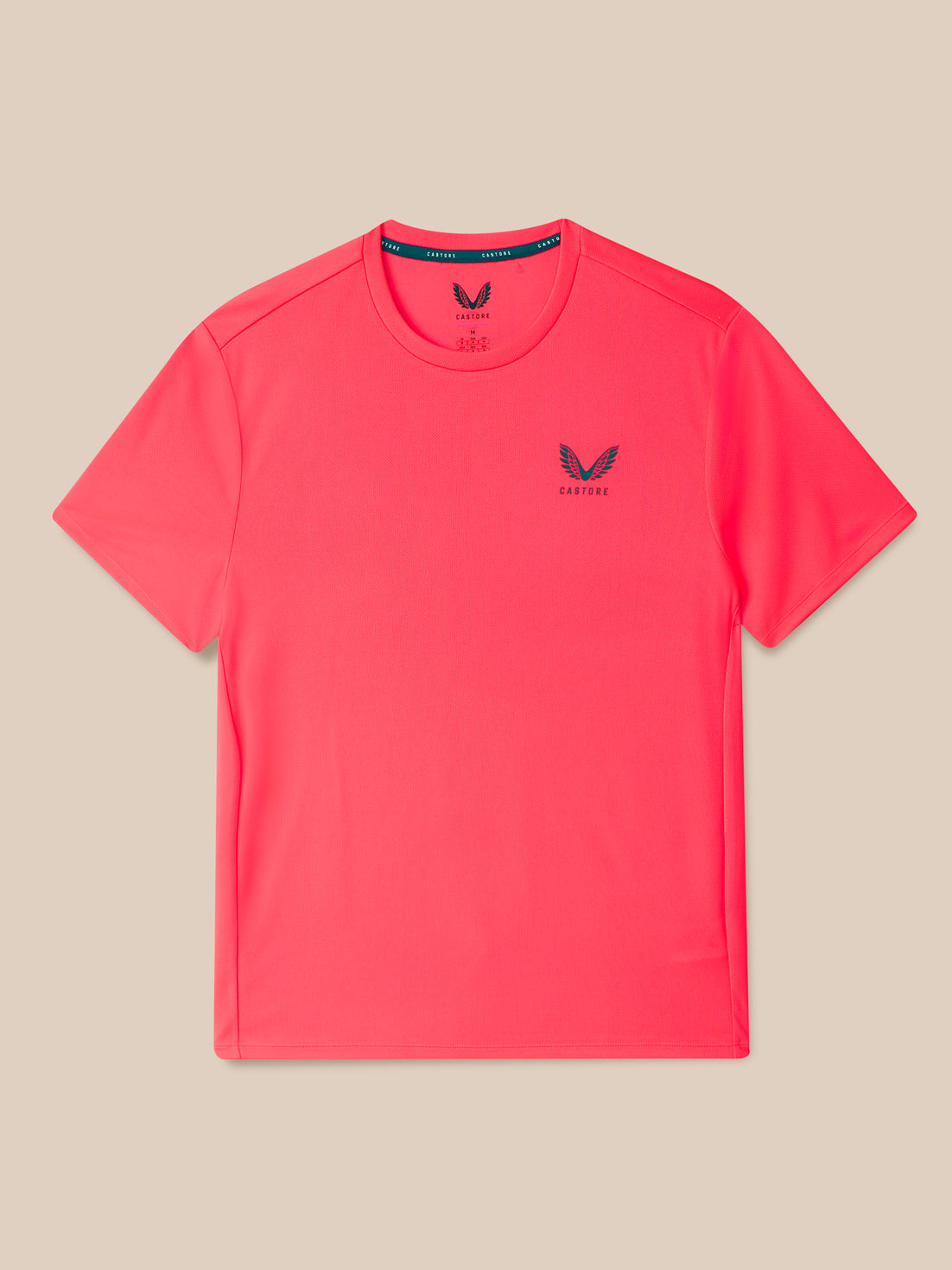Pink t-shirt with a logo on a beige background