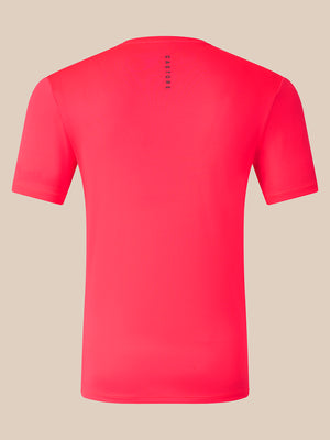 A bright pink short-sleeve athletic t-shirt shown from the back, featuring a vertical black 'CASTORE' logo printed on the upper back, set against a solid beige background.