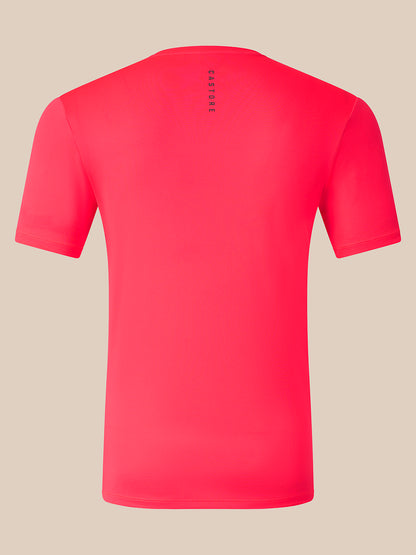A bright pink short-sleeve athletic t-shirt shown from the back, featuring a vertical black 'CASTORE' logo printed on the upper back, set against a solid beige background.
