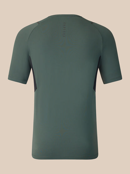 A short-sleeve athletic t-shirt shown from the back, featuring a crew neck and raglan sleeves in a solid dark sage green color, set against a solid beige background.
