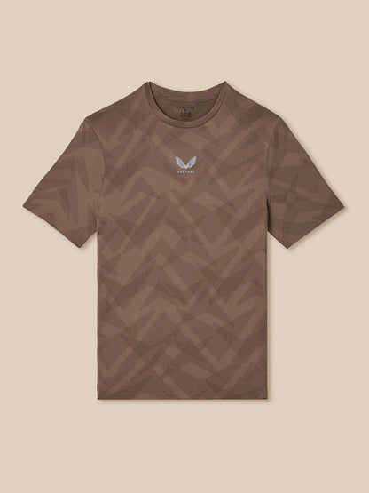 Brown t-shirt with geometric pattern on a beige background