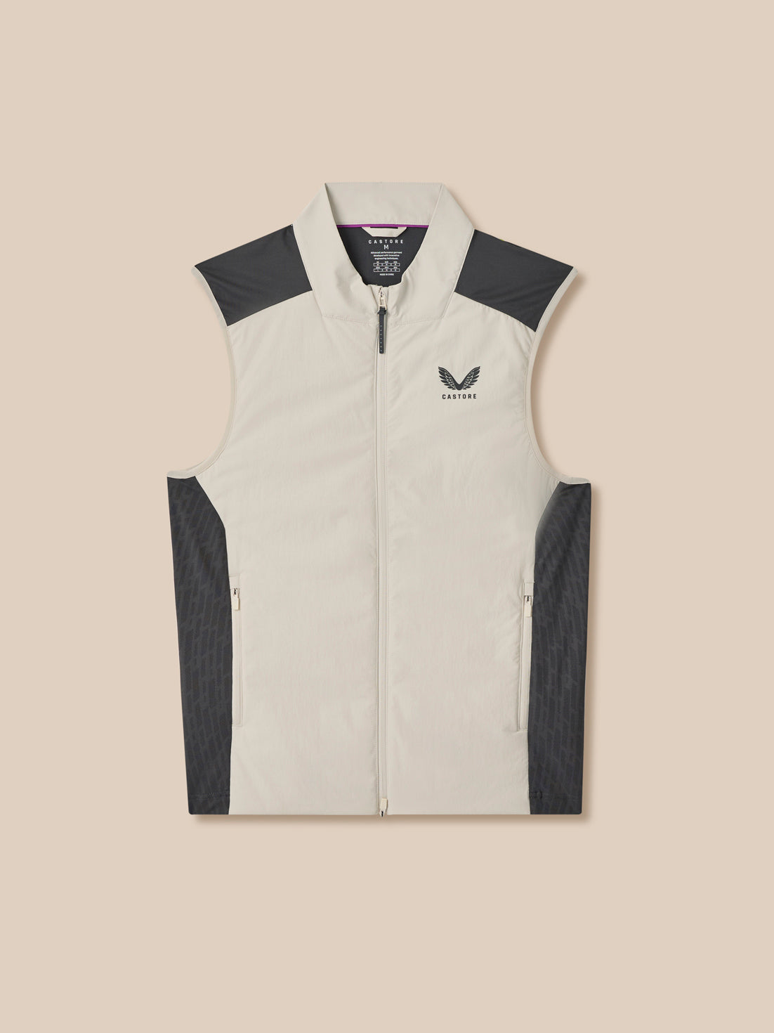 Light gray sleeveless jacket with dark gray accents on a beige background