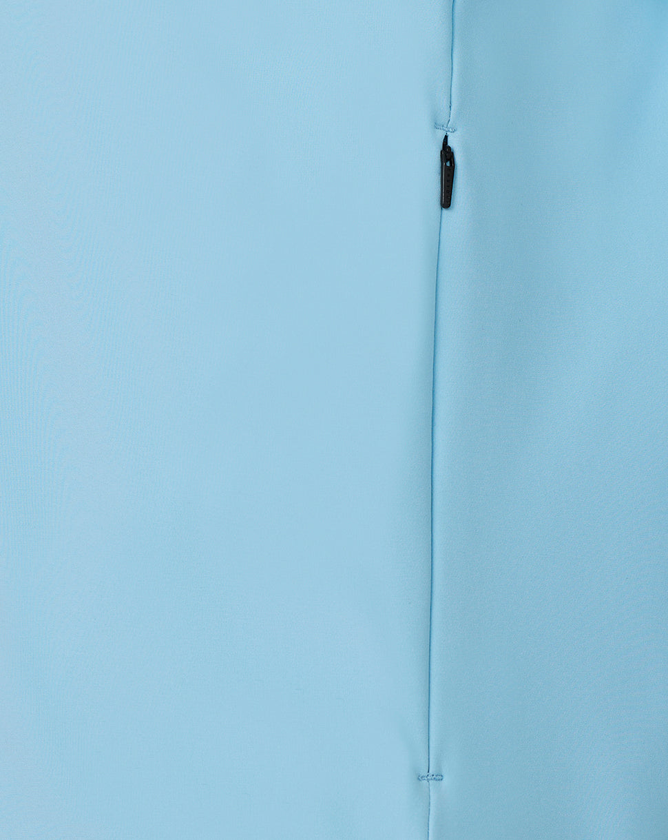 Close-up of a light blue fabric with a zipper running vertically.