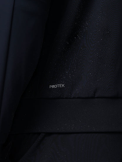 Close-up of a black fabric with 'PROTEK' branding.