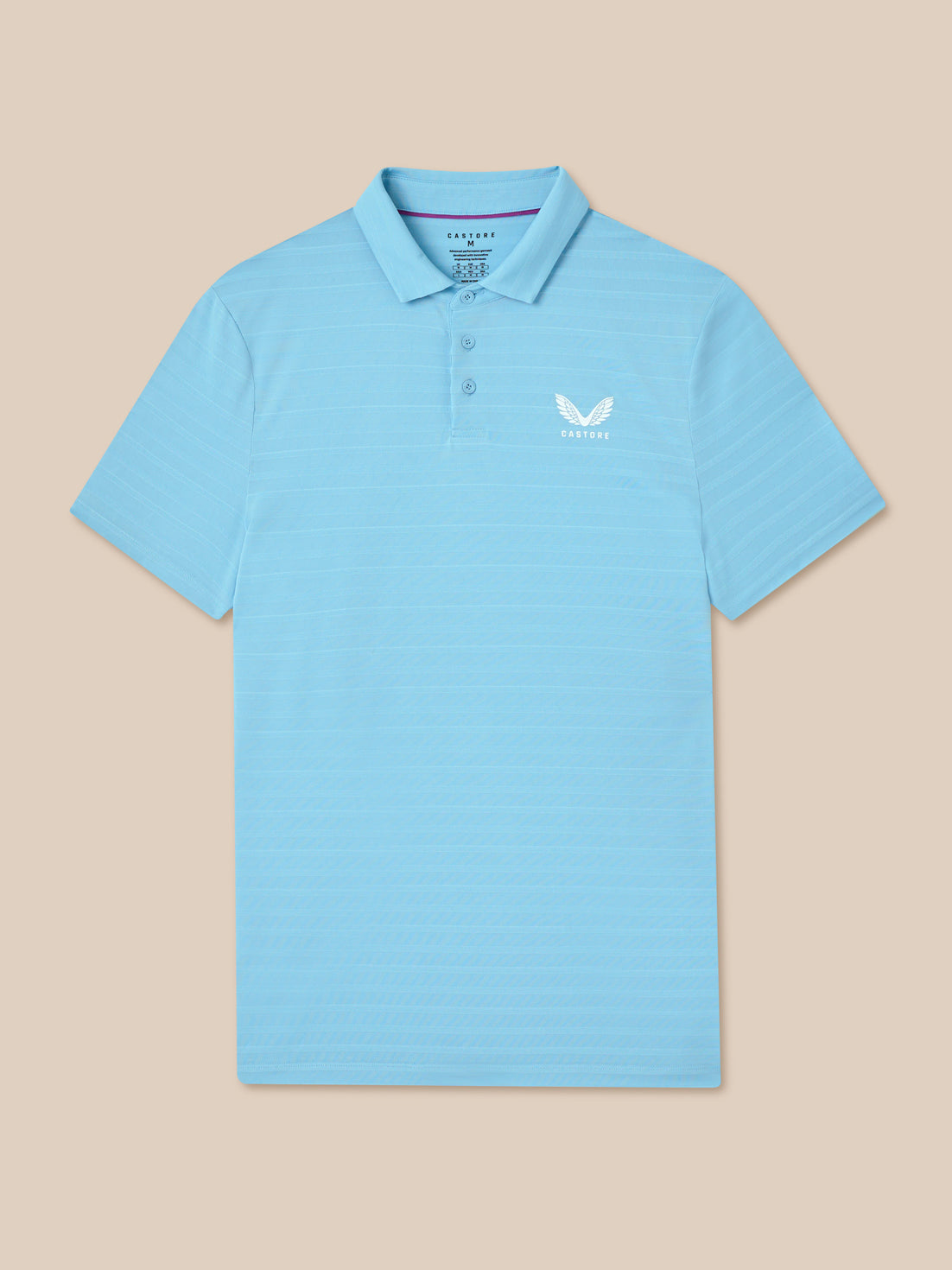 Light blue polo shirt with a small logo on a beige background