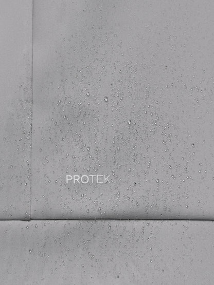 Close-up of a gray concrete surface with 'PROTEK' branding.