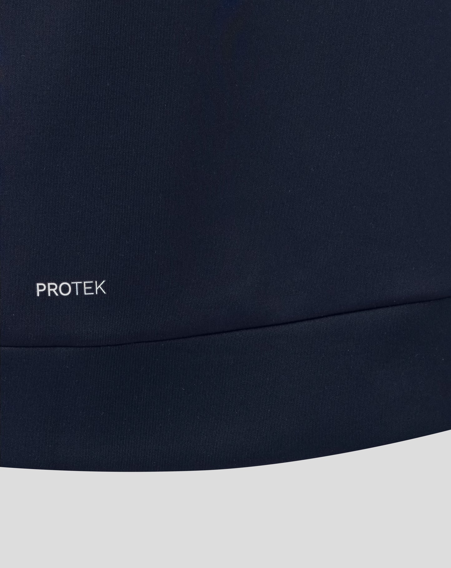 Navy blue fabric with 'PROTEK' logo on a white background