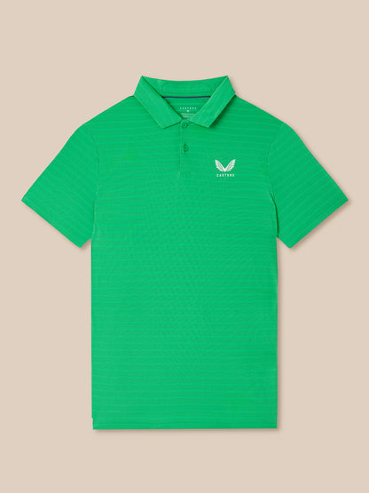Green striped polo shirt with a Castore logo on a beige background
