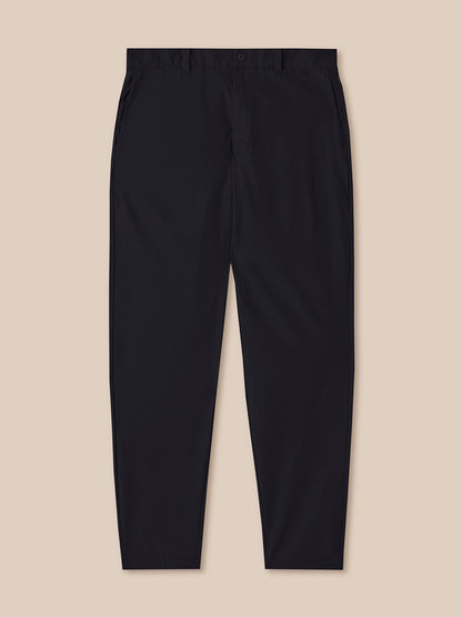 Black pants on a beige background