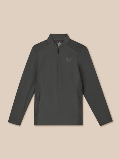 Dark gray long-sleeve shirt with a quarter zip on a beige background