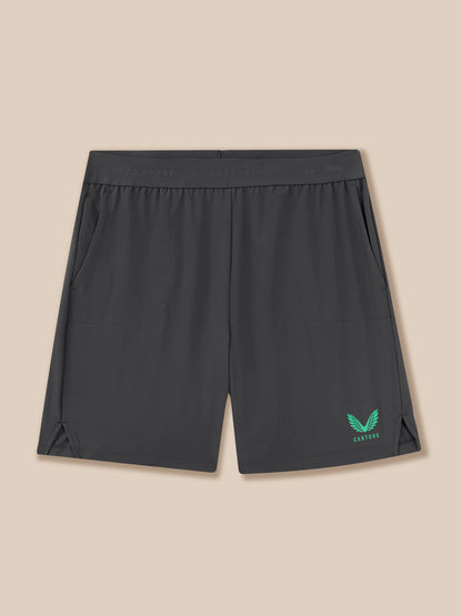 Black shorts with a logo on a beige background