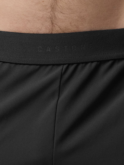 Close-up of black underwear with brand logo on waistband