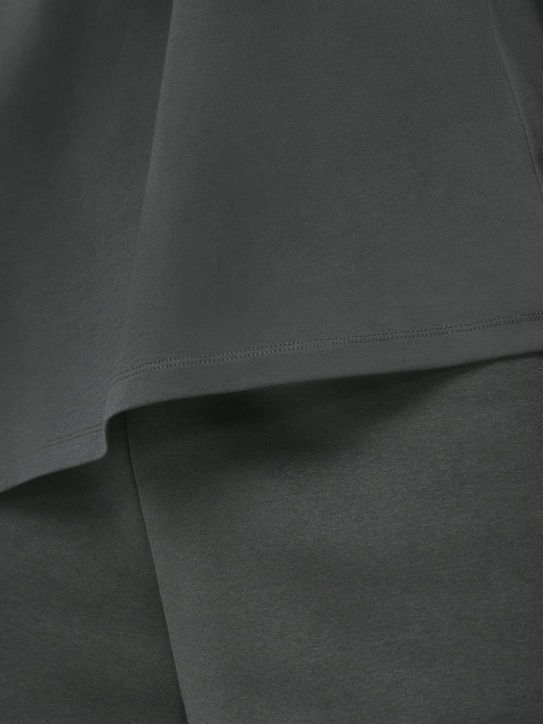 Close-up of dark gray fabric with a subtle texture