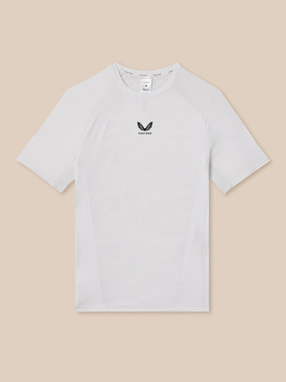White t-shirt with a logo on a beige background