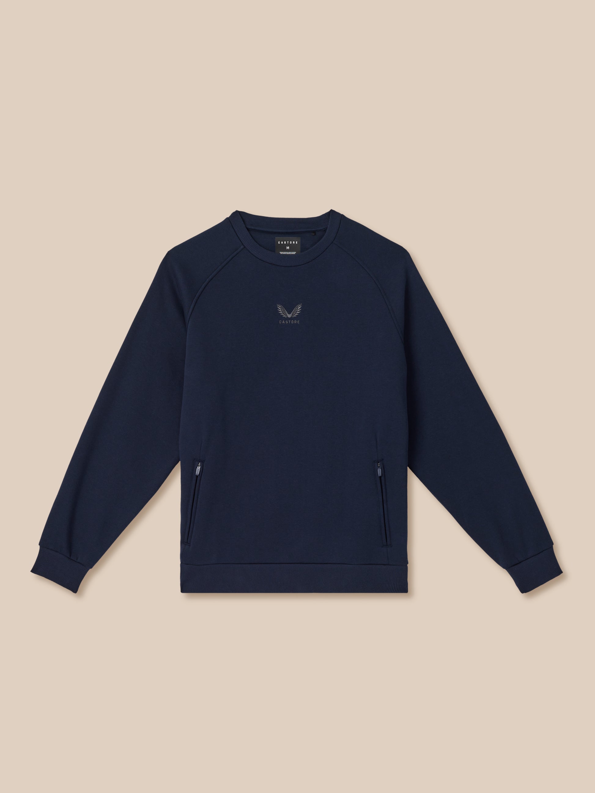 Navy blue sweatshirt with a logo on a beige background