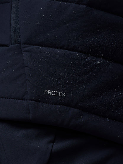 Close-up of a black quilted jacket with 'PROTEK' branding.