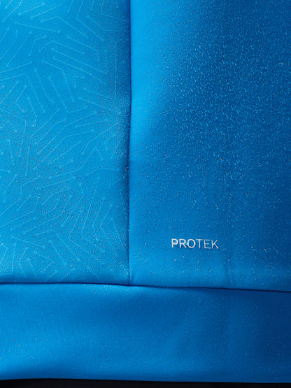 Blue fabric with a subtle pattern and 'PROTEK' branding.