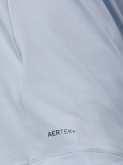 Close-up of a light gray fabric with 'AERTEK+' branding.