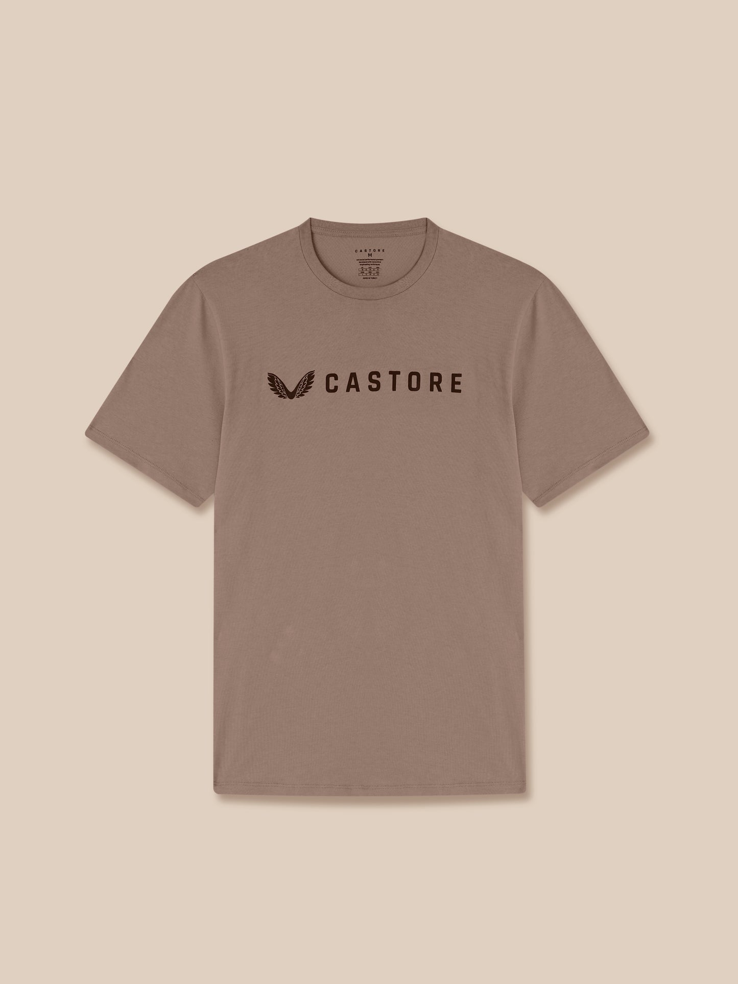 Brown t-shirt with 'CASTORE' logo on a beige background