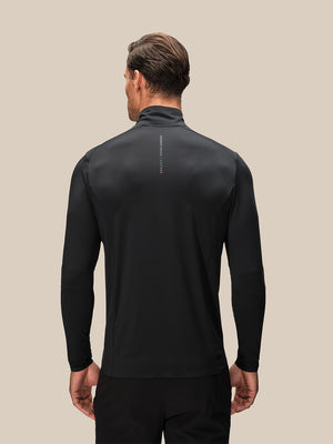 Back view of black long sleeve quarter zip top from Reiss x Castore on male model