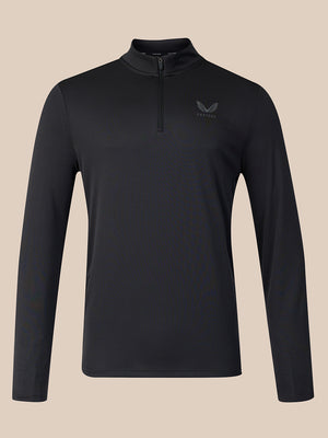 A black long-sleeve quarter-zip athletic top with a small dark gray wing logo on the left chest, displayed on a solid beige background.