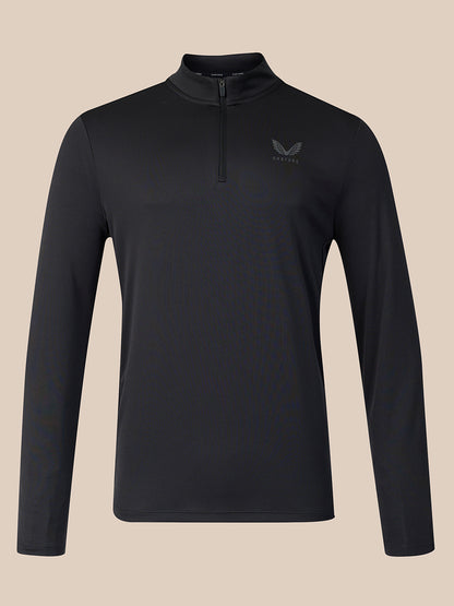 A black long-sleeve quarter-zip athletic top with a small dark gray wing logo on the left chest, displayed on a solid beige background.