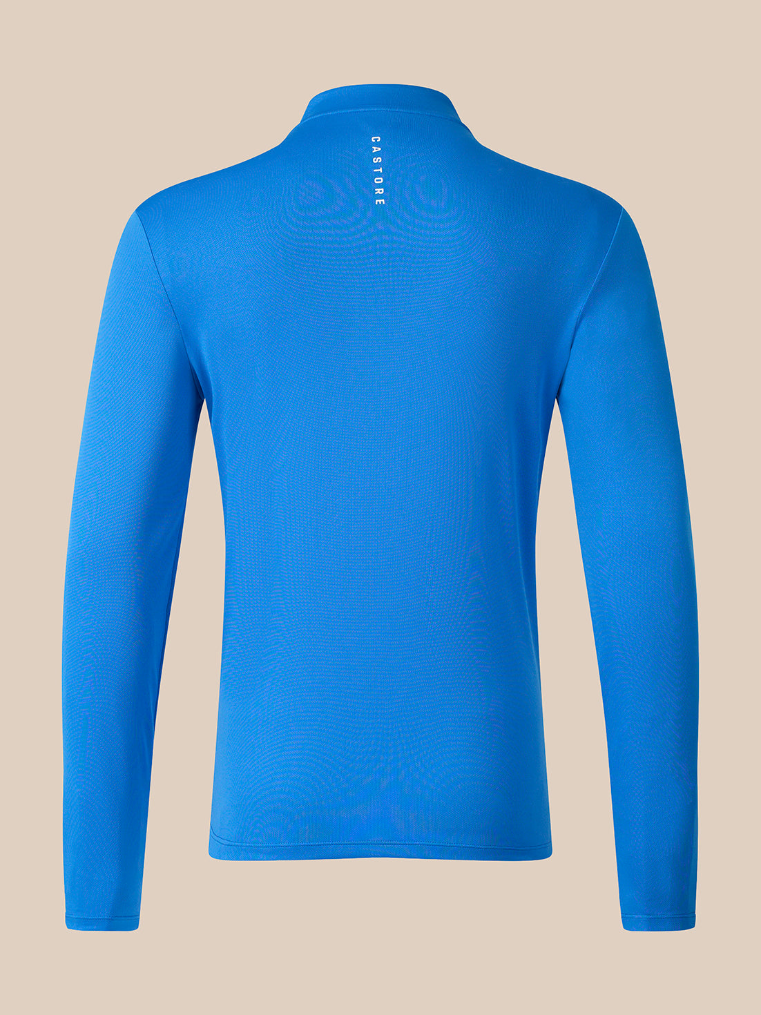 A bright blue long-sleeve athletic top shown from the back, featuring a mock neck and a small vertical white 'CaSTORE' logo printed at the center back, set against a solid beige background.