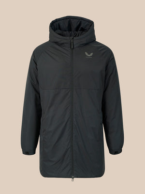 A dark gray hooded jacket with a full front zipper and a small winged logo on the left chest, displayed against a solid beige background.
