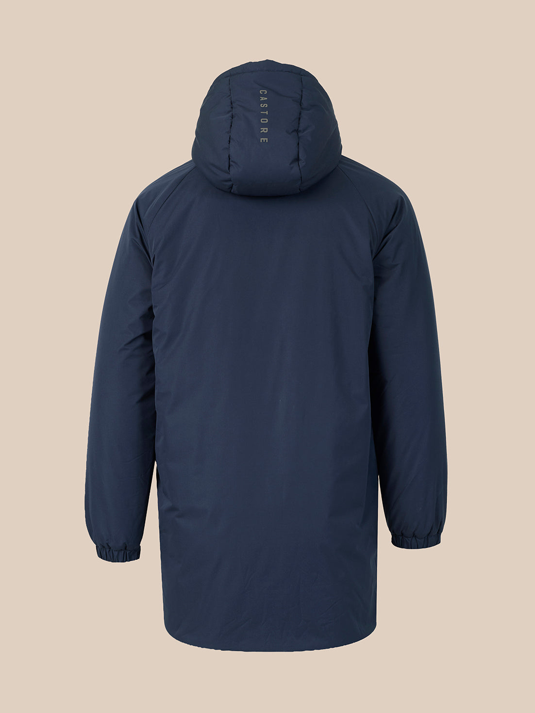 A dark navy hooded jacket shown from the back, featuring a vertical 'CASTORE' logo printed on the back of the hood, set against a solid beige background.