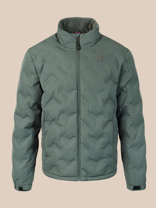 A sage green quilted puffer jacket with a stand-up collar and front zipper, featuring a small embroidered wing logo on the left chest, displayed against a solid beige background.