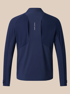 Back view of navy LVS Jacket with vertical Castore logo and back vent slits