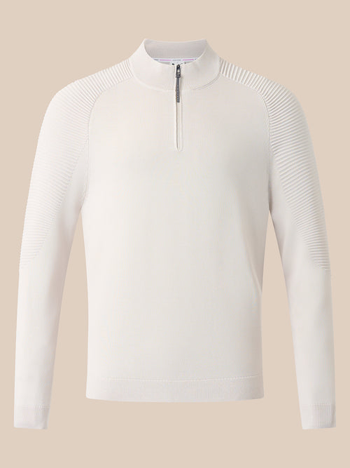Cream knit long sleeve top with ribbed shoulder panels and funnel neckline with quarter zip.