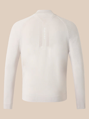 Back view of cream seamless knitted golf top with raised ribbed panels on sleeves and upper back