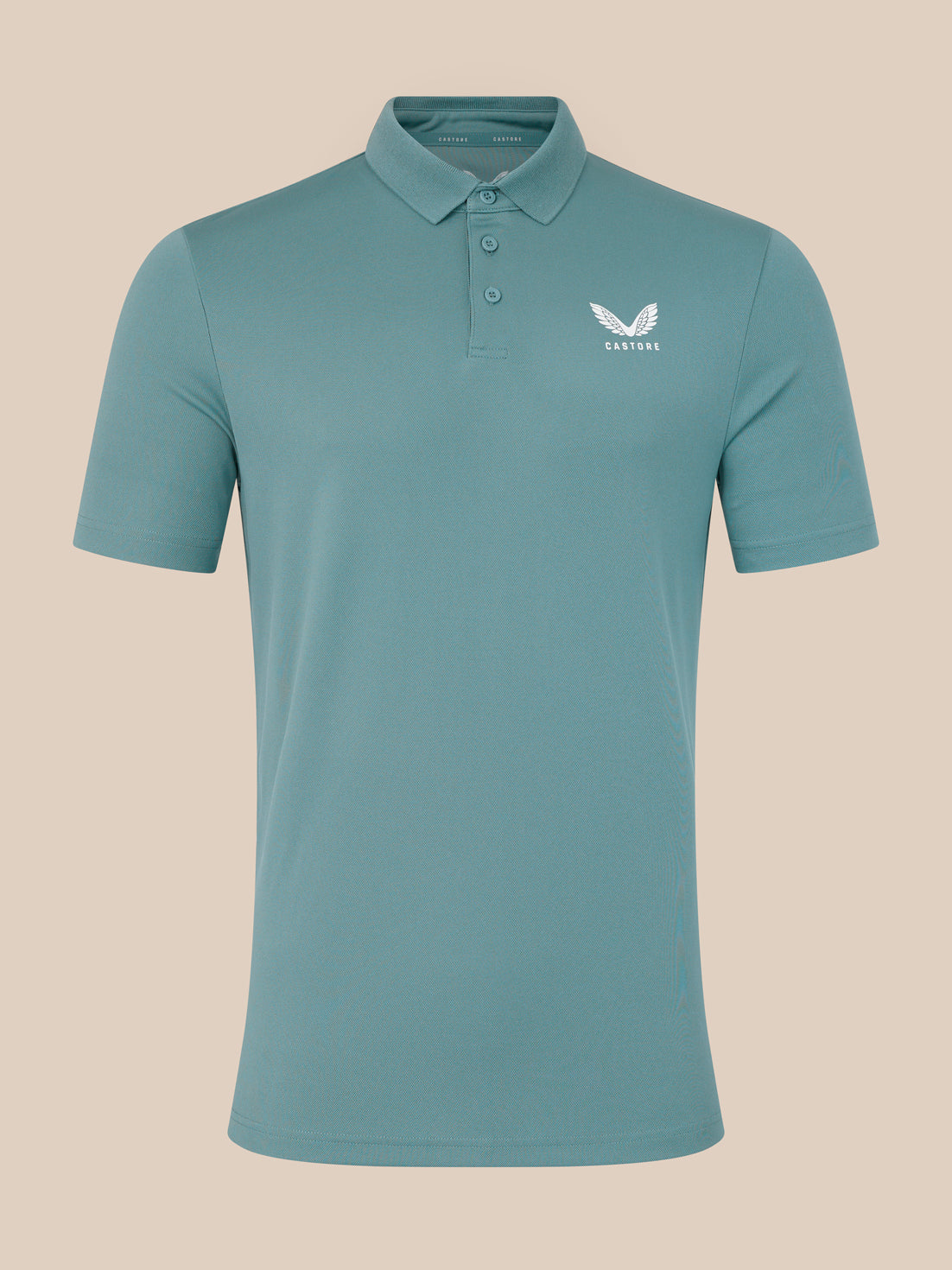 Teal polo shirt with a logo on a beige background