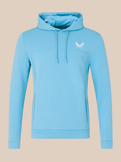 Light blue hoodie with a brand logo on a beige background
