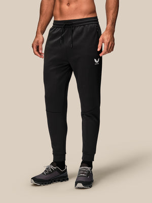 Front view of black men's Flex Joggers with drawstring waist and Castore logo on left thigh.