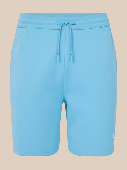 Light blue shorts with a drawstring on a beige background