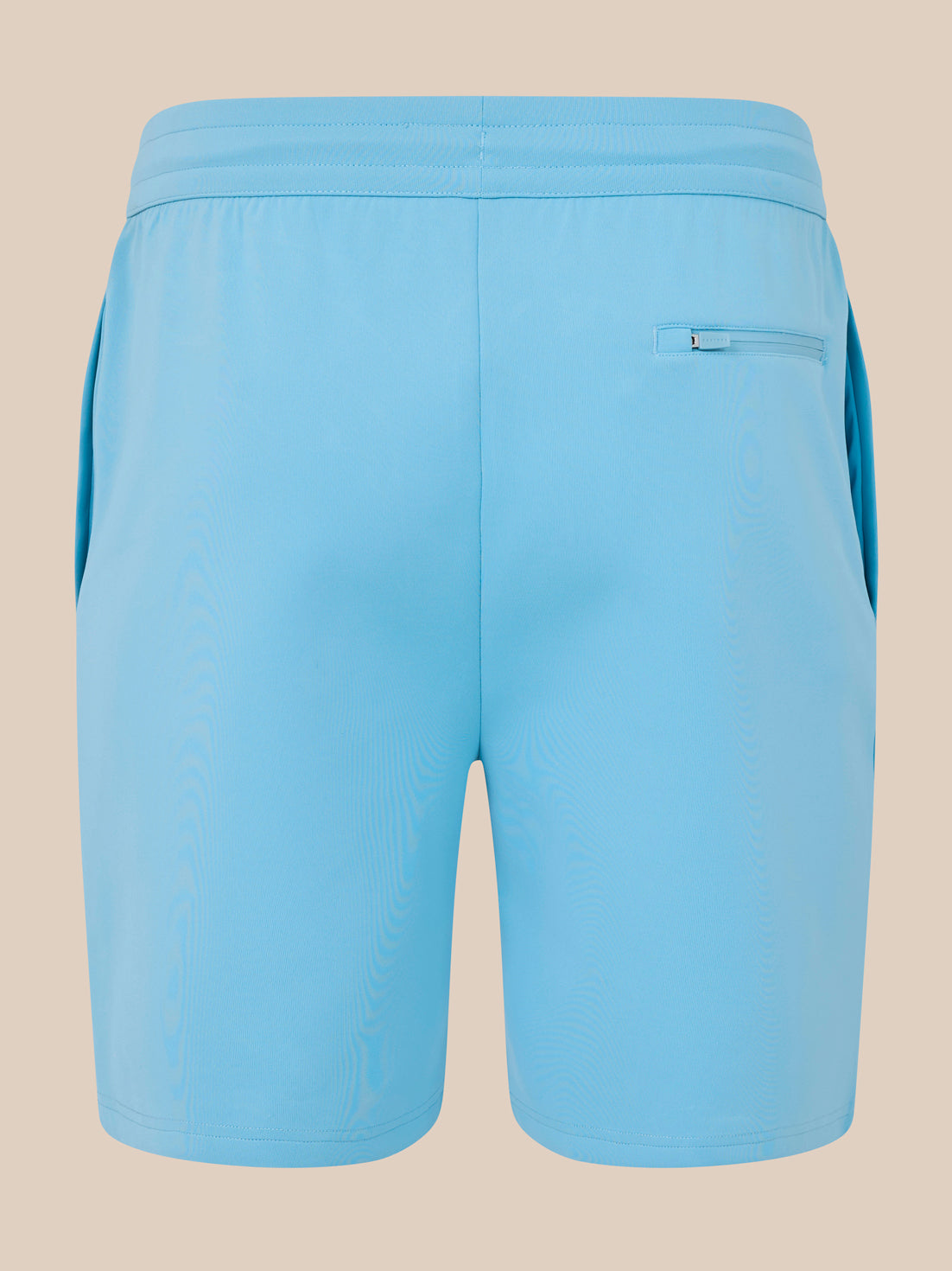 Light blue shorts on a beige background