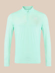 A light mint green long-sleeve athletic quarter-zip pullover with a small white logo on the left chest, displayed on a solid beige background.