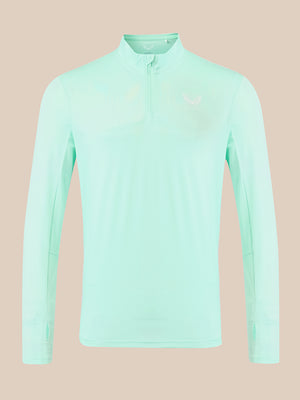 A light mint green long-sleeve athletic quarter-zip pullover with a small white logo on the left chest, displayed on a solid beige background.