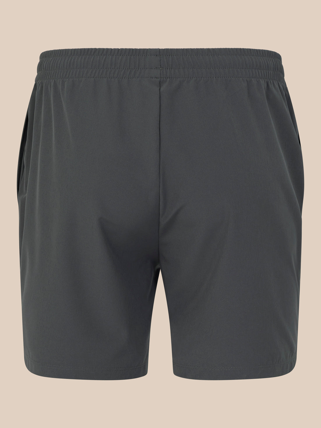 Dark gray shorts on a beige background
