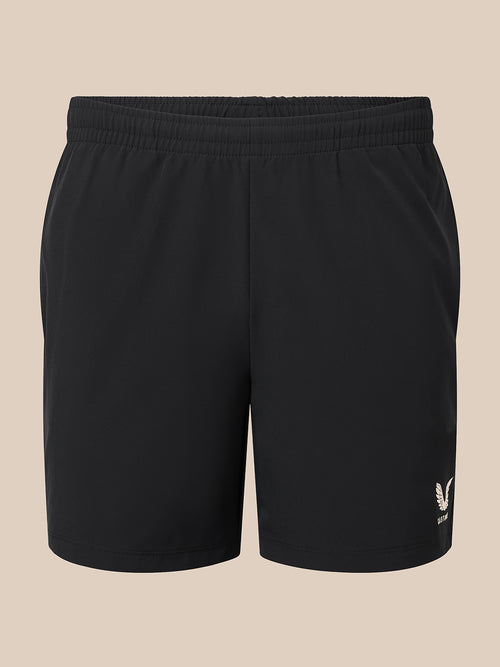 Front view of black men's 6 inch shorts with elastic waistband and small logo on the leg