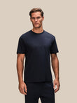Male model wearing navy Flex short sleeve T shirt with small Castore logo on the chest