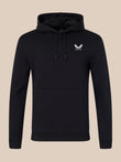 Black hoodie with a white logo on a beige background