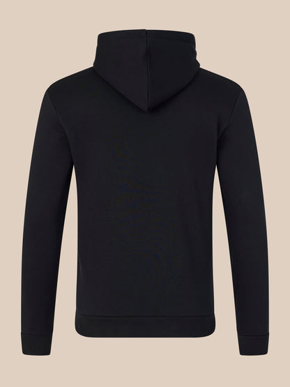 Black hoodie on a beige background