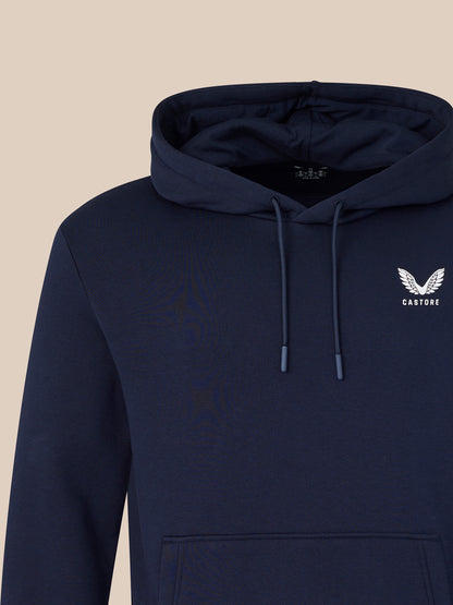 Navy blue hoodie with a logo on a beige background